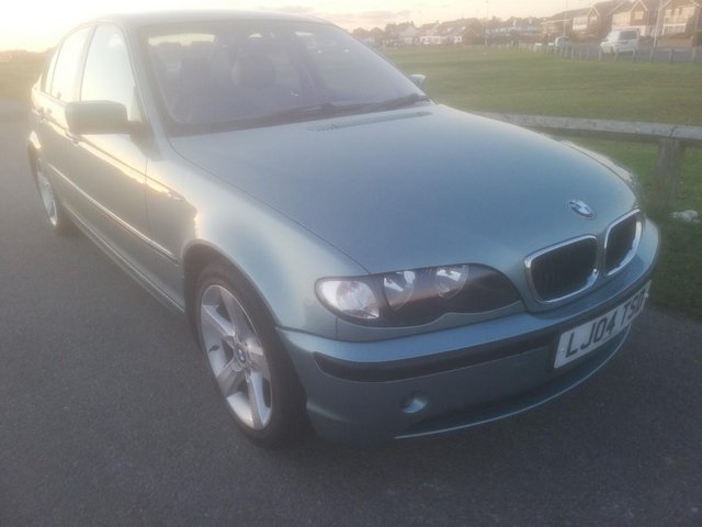 bmw 318ise automatic  light green miles