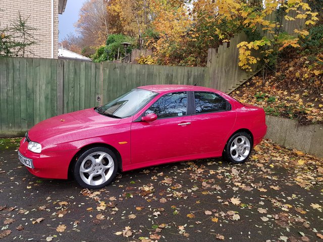 Red 4 Door Petrol 2 litre Romeo JTS.