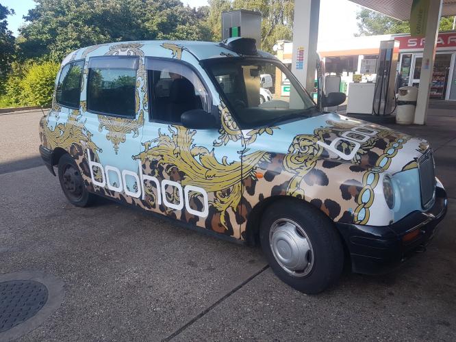 53 plate London cab wrapped with boohoo logo