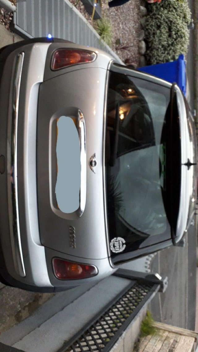 Silver mini cooper hatchback