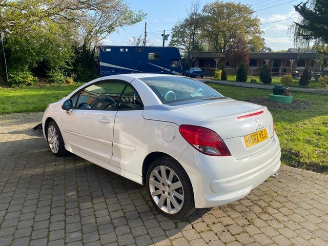  white Peugeot 207 convertible