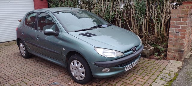 Peugeot 206, less than  miles from new