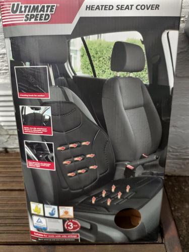 Heated car seat cover plugs into cigarette lighter